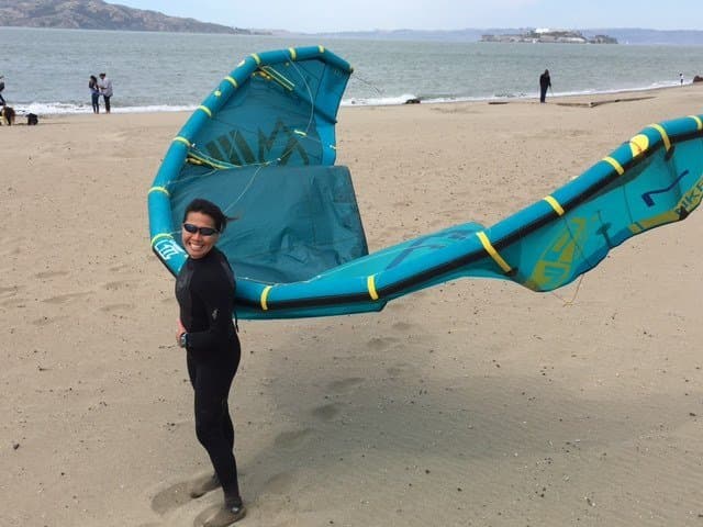 Dr. Sonya Kim kiteboarding on the beach near Alcatraz